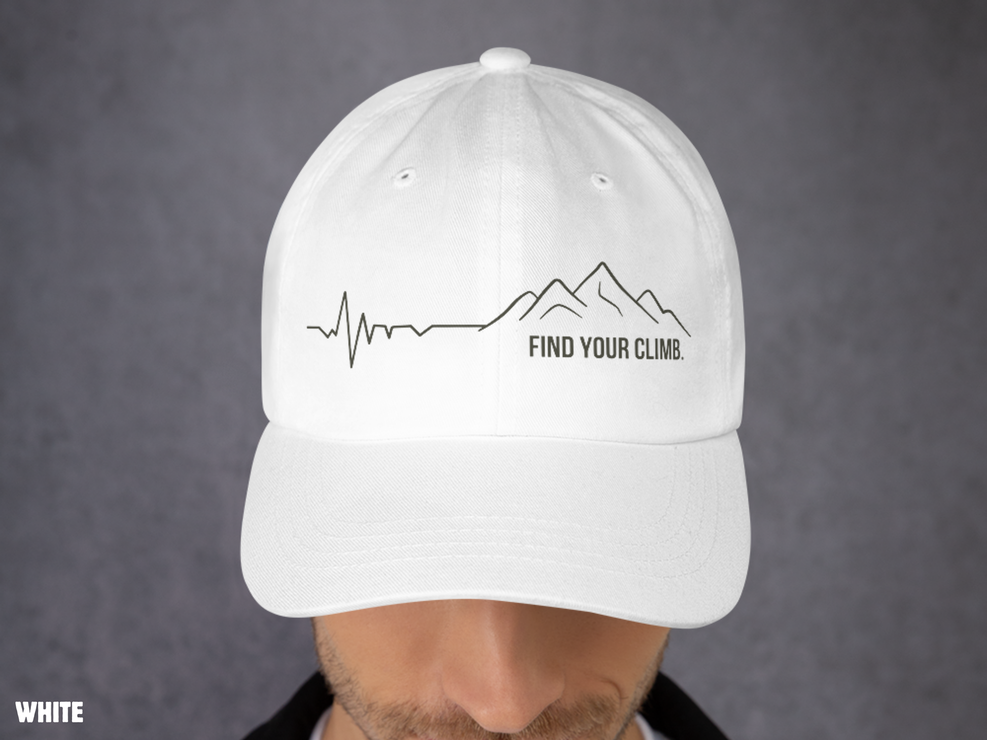 A white baseball cap with a black mountain line graphic and the text 'FIND YOUR CLIMB.' on the front, shown worn by a person against a gray background.